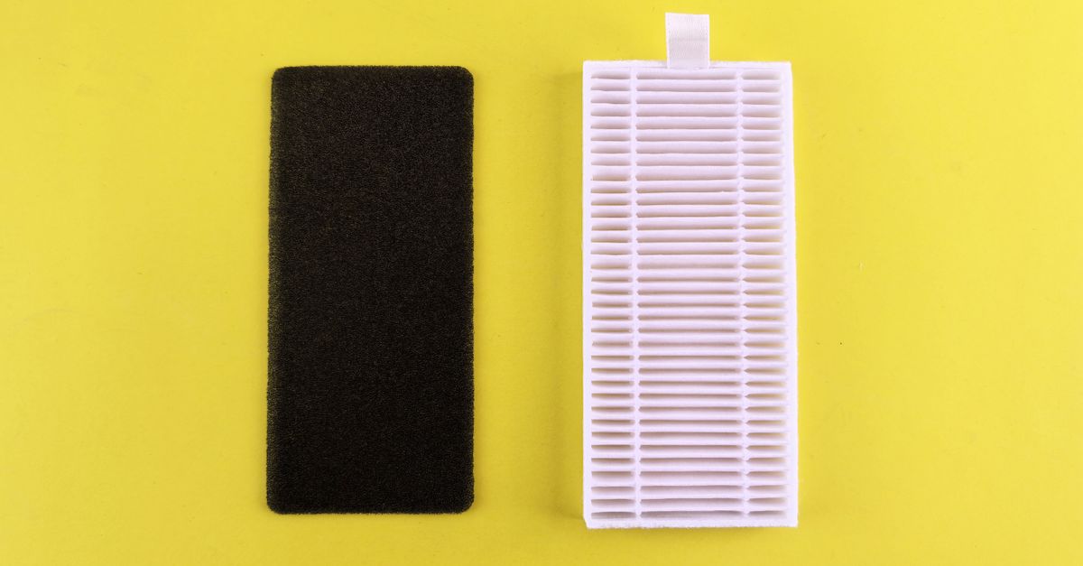 Black foam filter and white air filter on bright yellow backdrop showcasing air purification essentials.