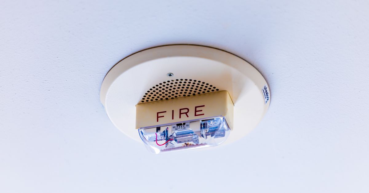 Close-up view of a ceiling-mounted fire alarm system ensuring safety in a building.